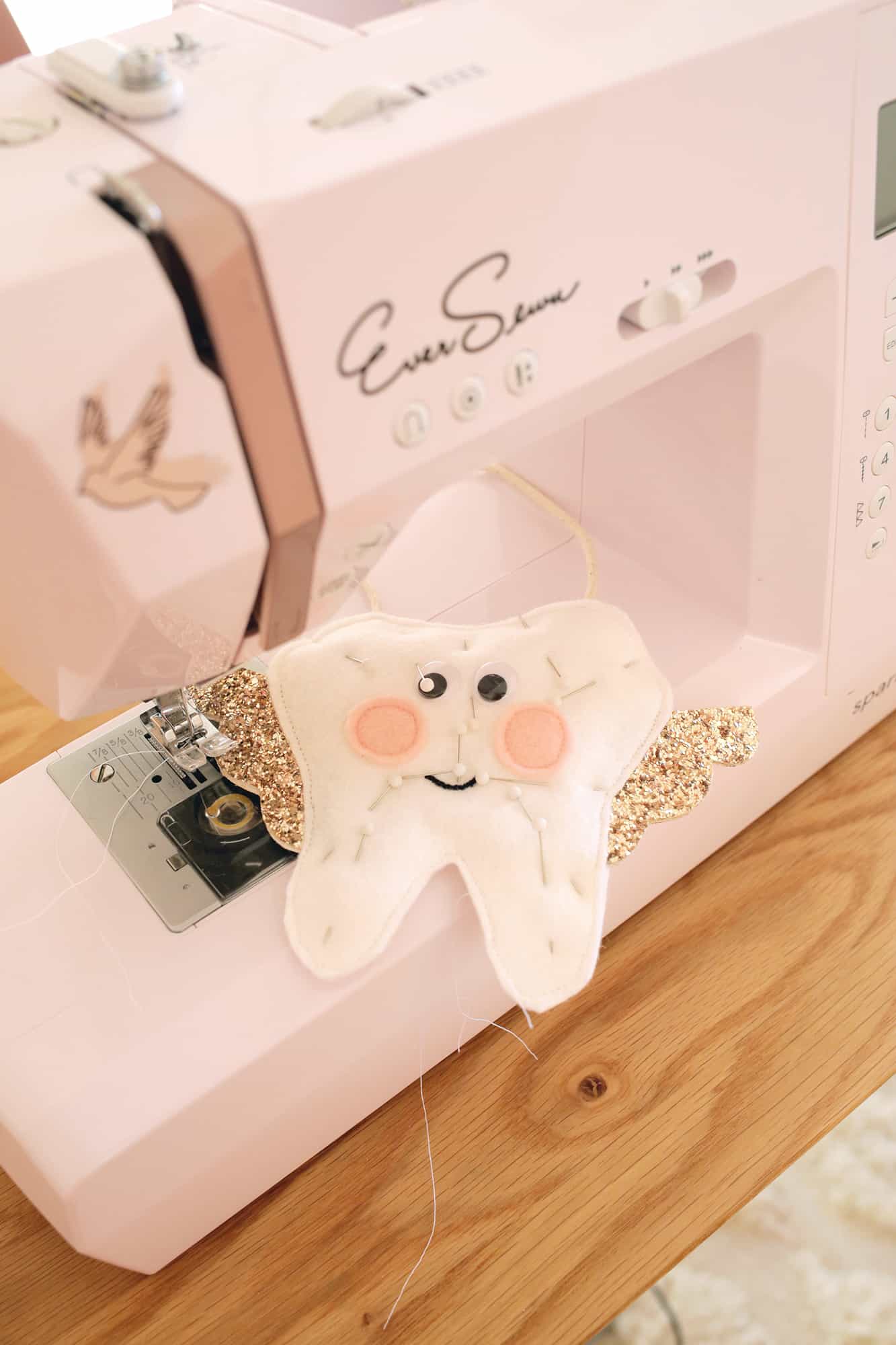 Tooth pillow being sewn around the edge