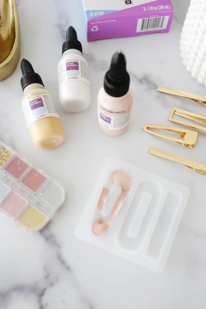 barrette mold, barrette clips, and liquid clay bottles