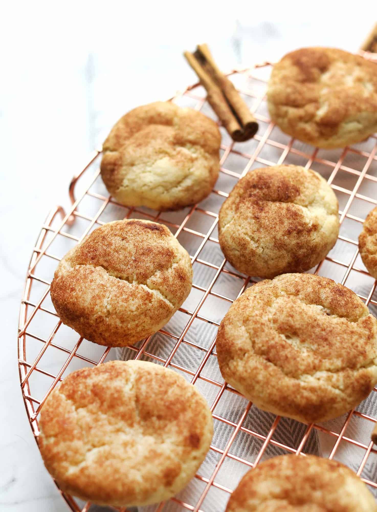 soft chewy snickerdoodles on cooling rack